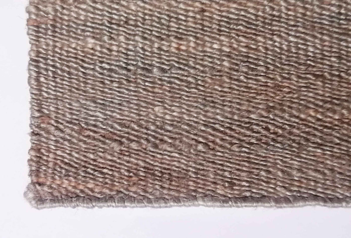 Textura de fibra vegetal en alfombra sisal importada resistente