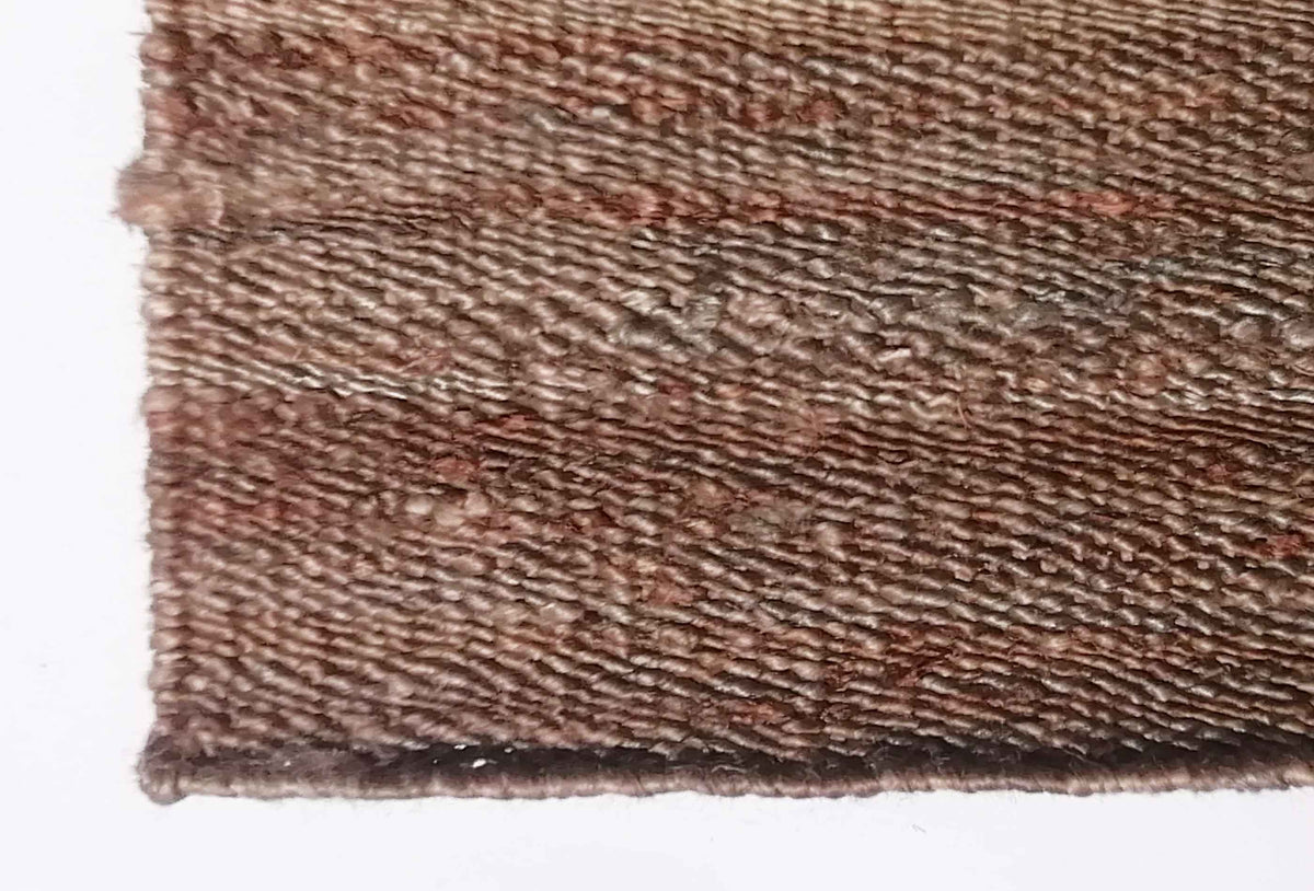 Textura de fibra vegetal yute en alfombra decorativa importada