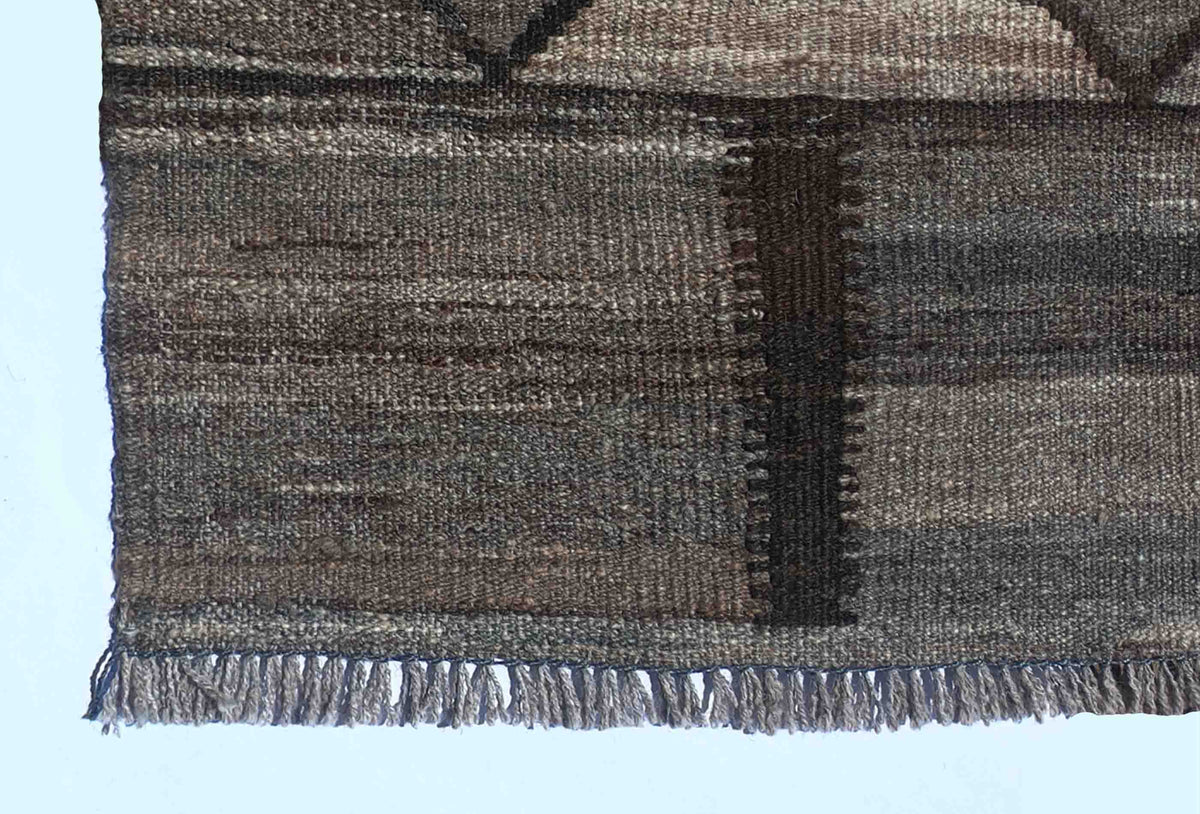 Textura de lana natural en alfombra Kelim hecha a mano, teñida con tintes naturales