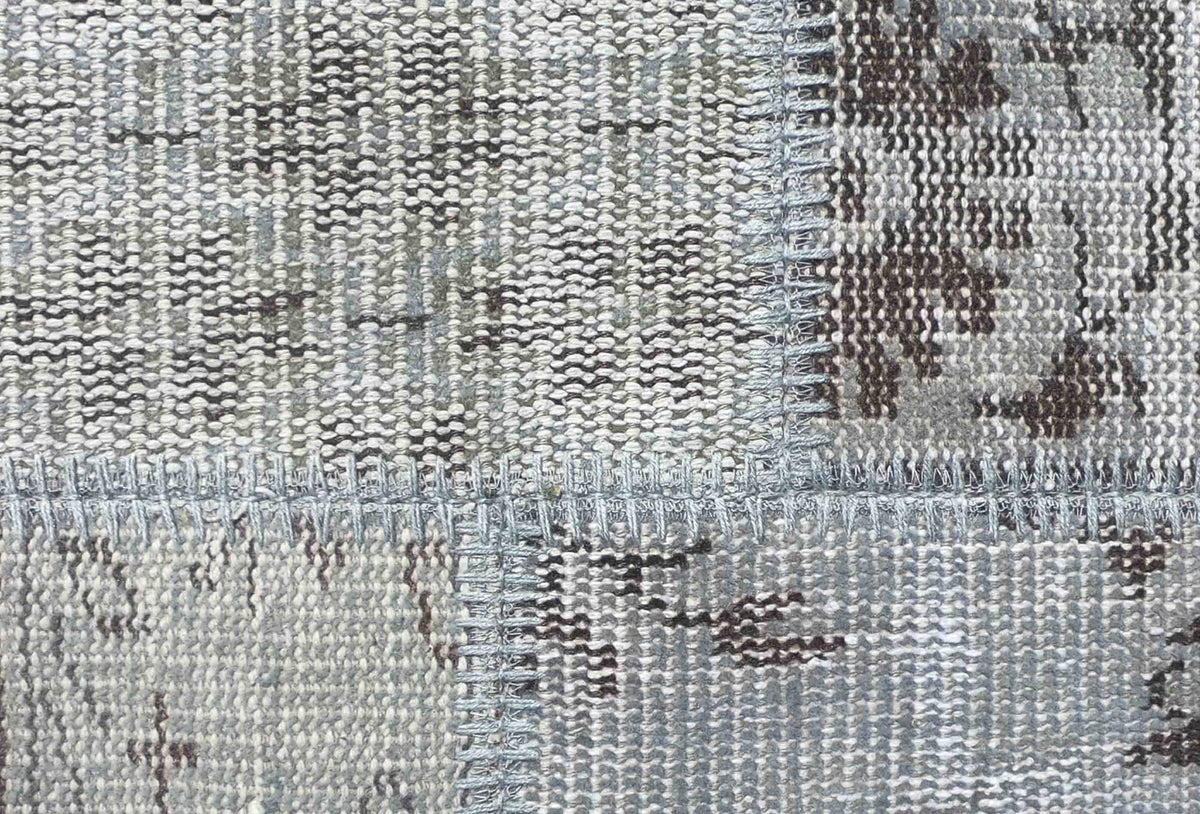 Textura natural de lana en alfombra persa hecha a mano, aspecto desgastado