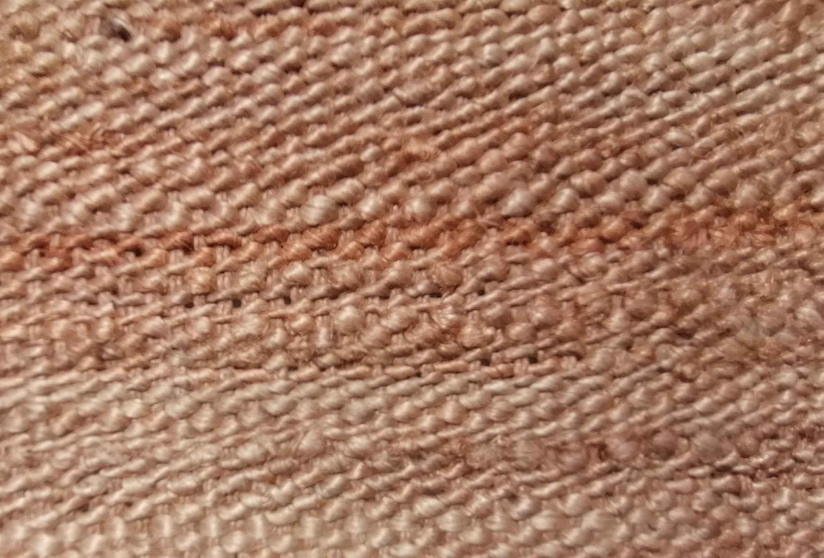 Detalle tejido artesanal de alfombra sisal natural de origen indio