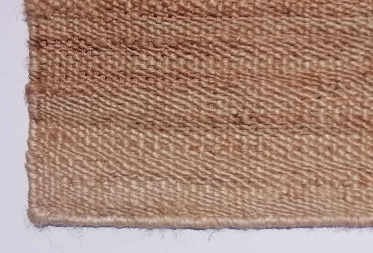 Textura del yute natural en alfombra importada hecha a mano