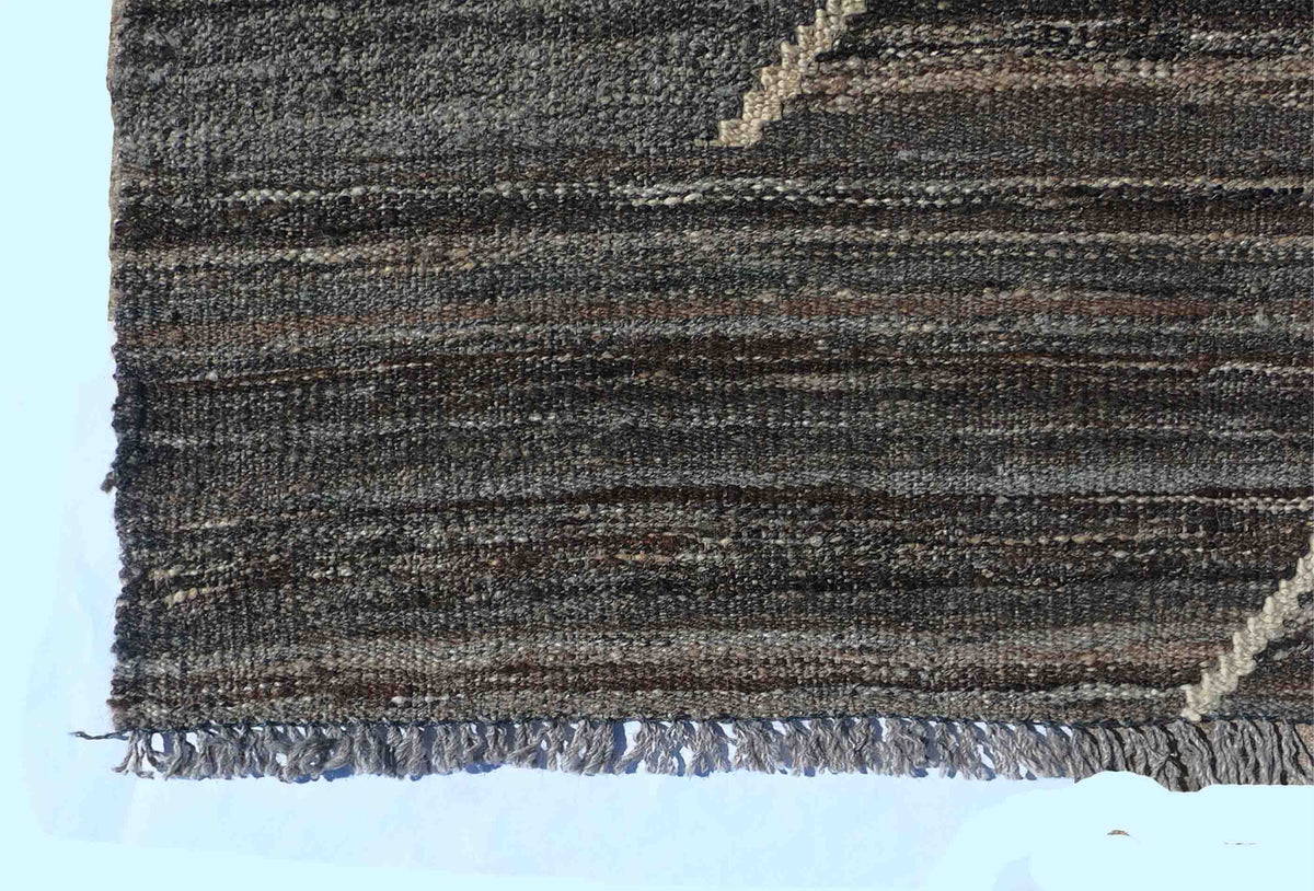 Textura de lana natural en alfombra Kelim hecha a mano con tintes orgánicos