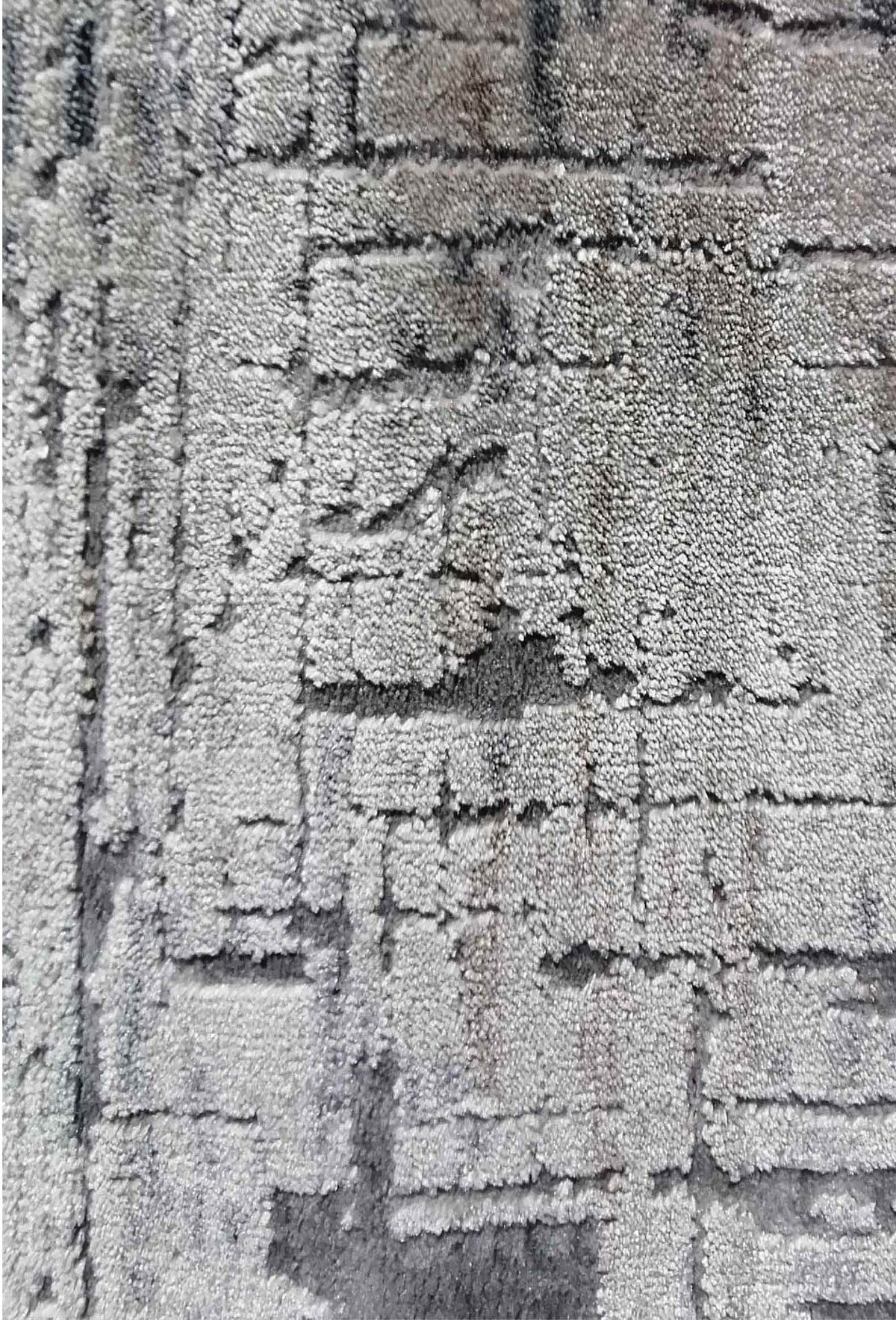 Detalle de diseño contemporáneo en alfombra turca importada
