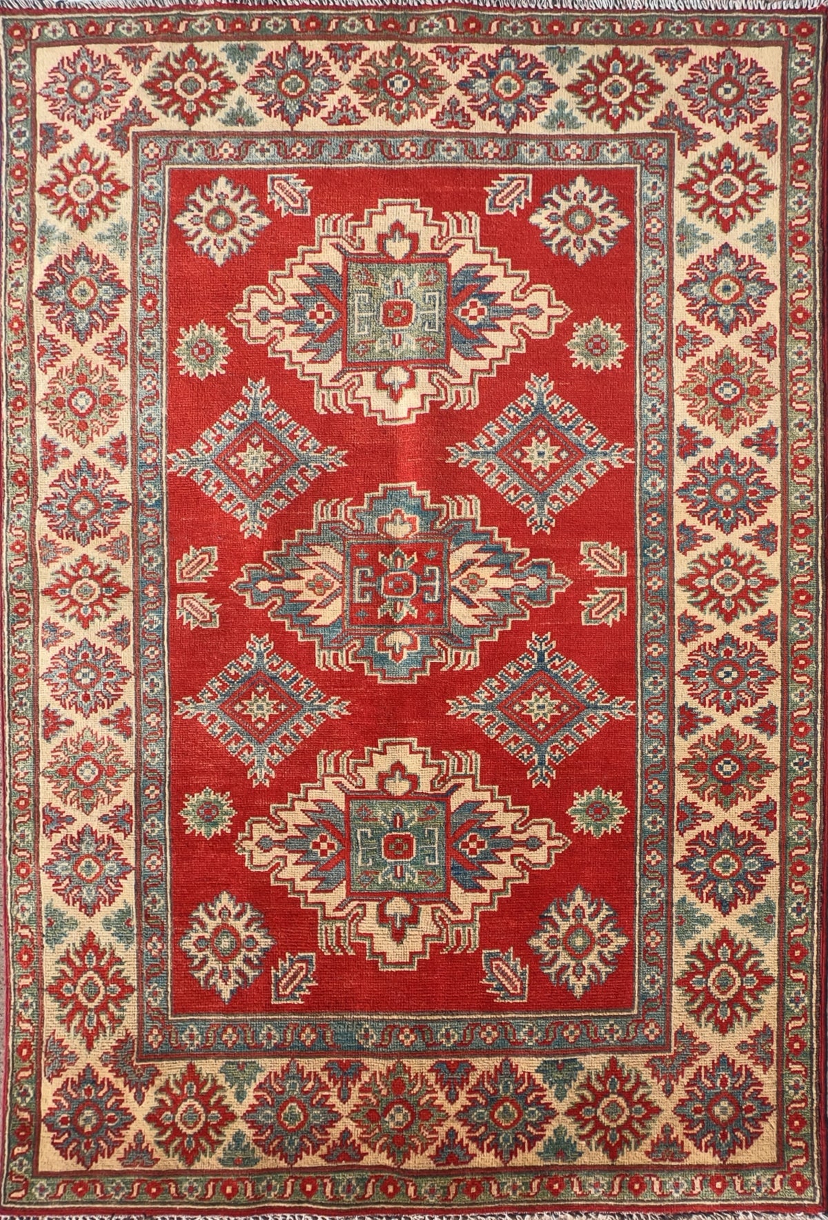 Alfombra persa Kazak de lana roja con diseño geométrico
