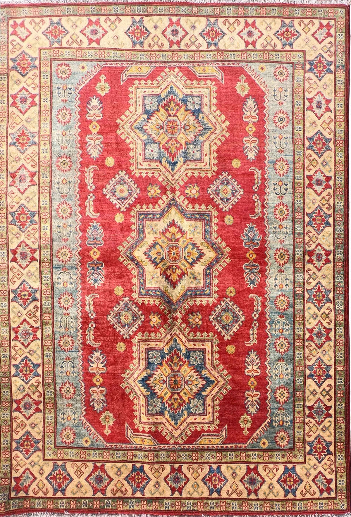 Alfombra persa Kazak de lana con diseño geométrico en tonos rojos