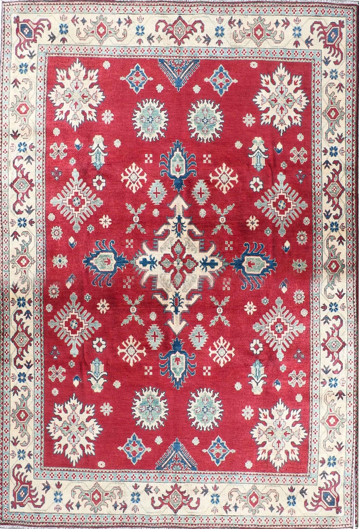 Alfombra persa Kazak de lana color rojo y diseño geométrico clásico
