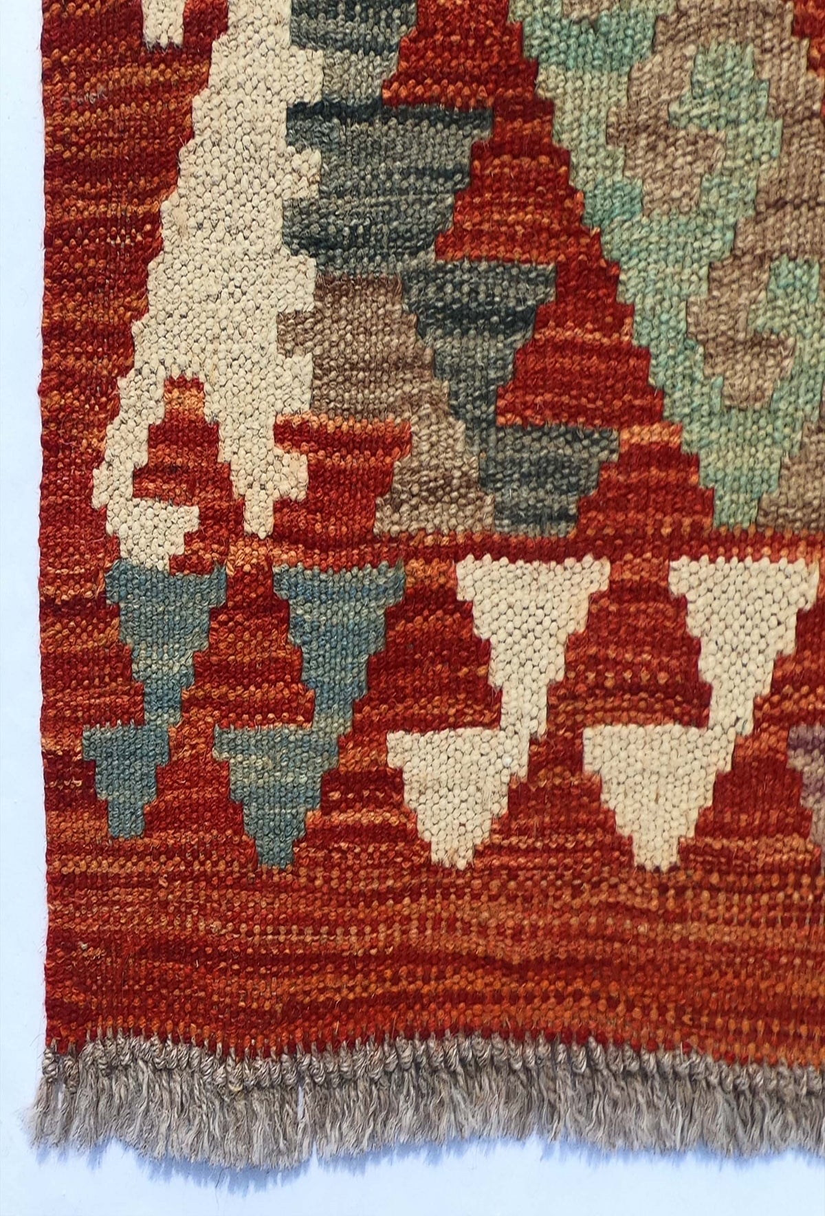 Textura del tejido plano de lana en alfombra importada hecha a mano