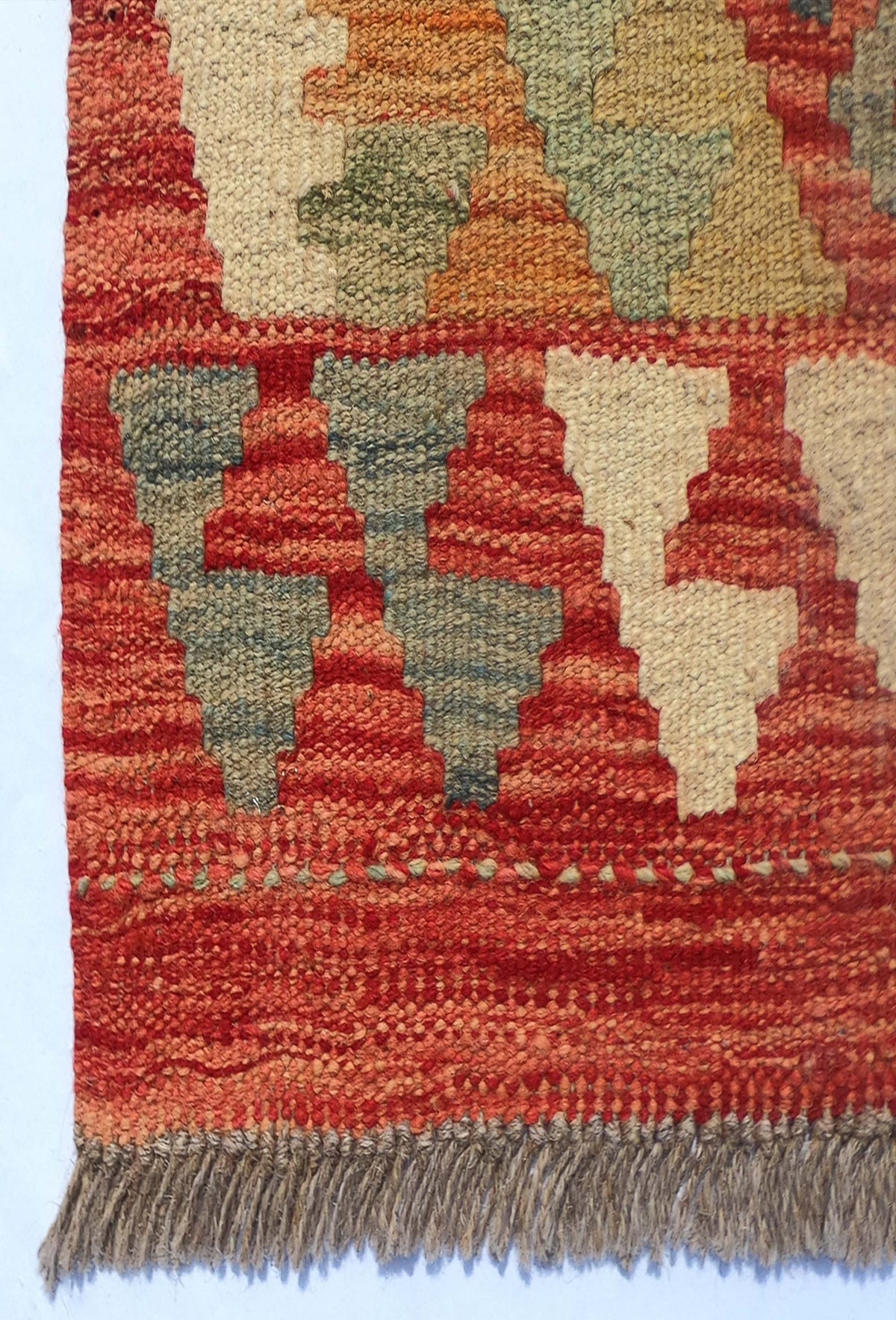 Textura de lana tejida en telar de alfombra Kelim artesanal