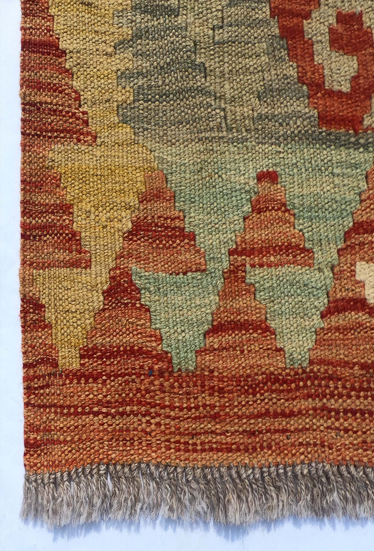 Textura de lana natural en alfombra Kelim hecha a mano, teñida con tintes naturales