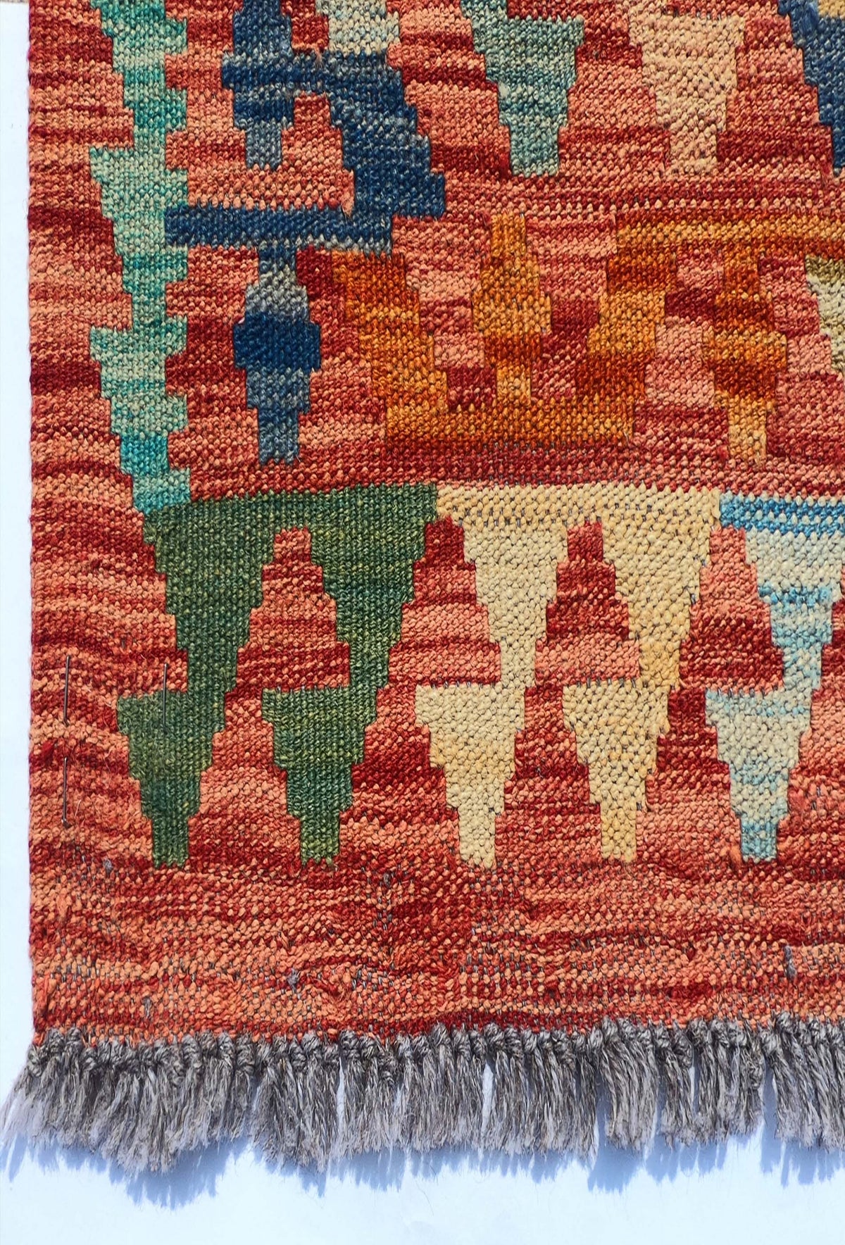 Textura de lana natural en alfombra Kelim hecha a mano, tintes naturales