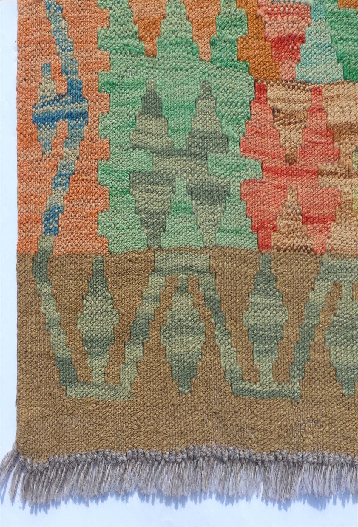 Textura de lana natural en alfombra Kelim hecha a mano con tintes naturales
