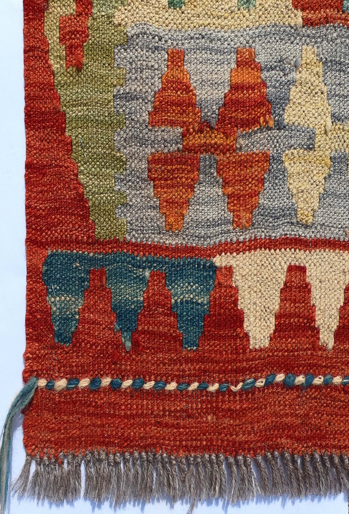 Textura de lana natural de alfombra Kelim importada, teñida con tintes naturales
