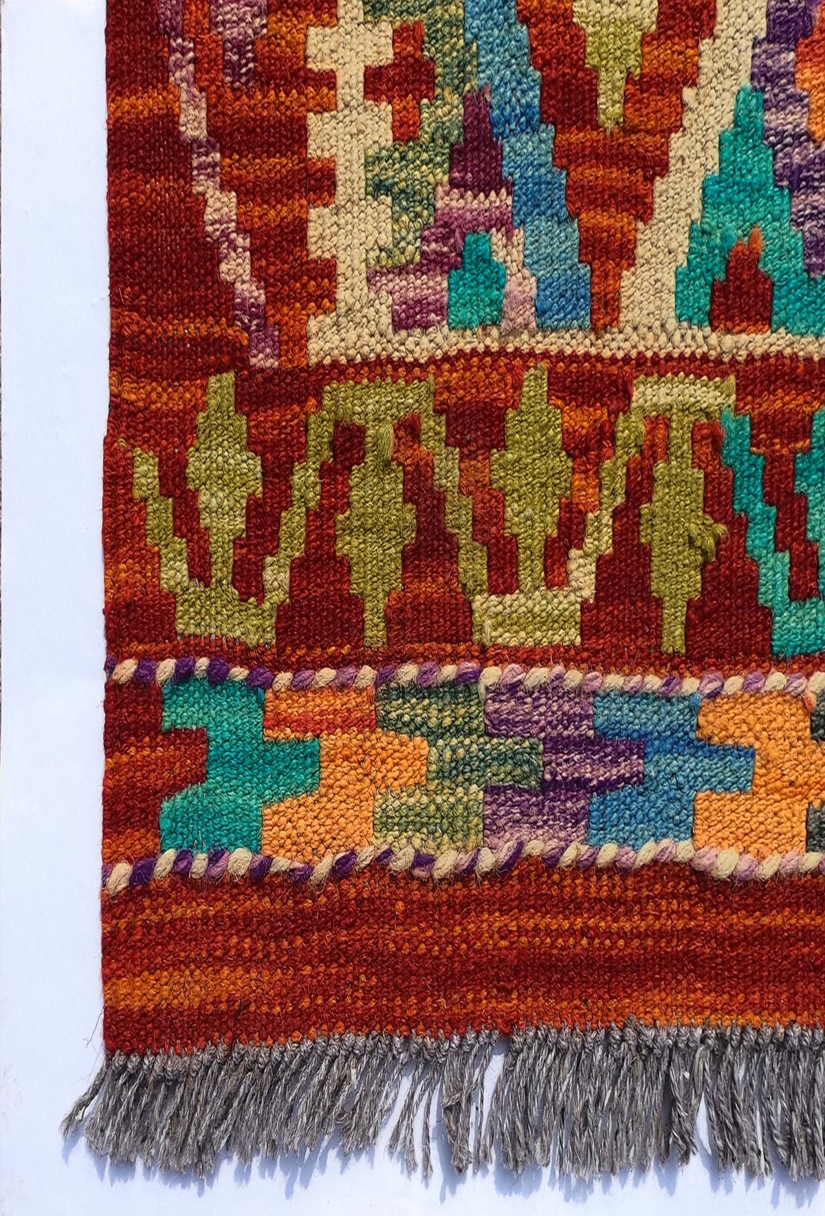 Textura de lana natural en alfombra Kelim hecha a mano con tintes naturales