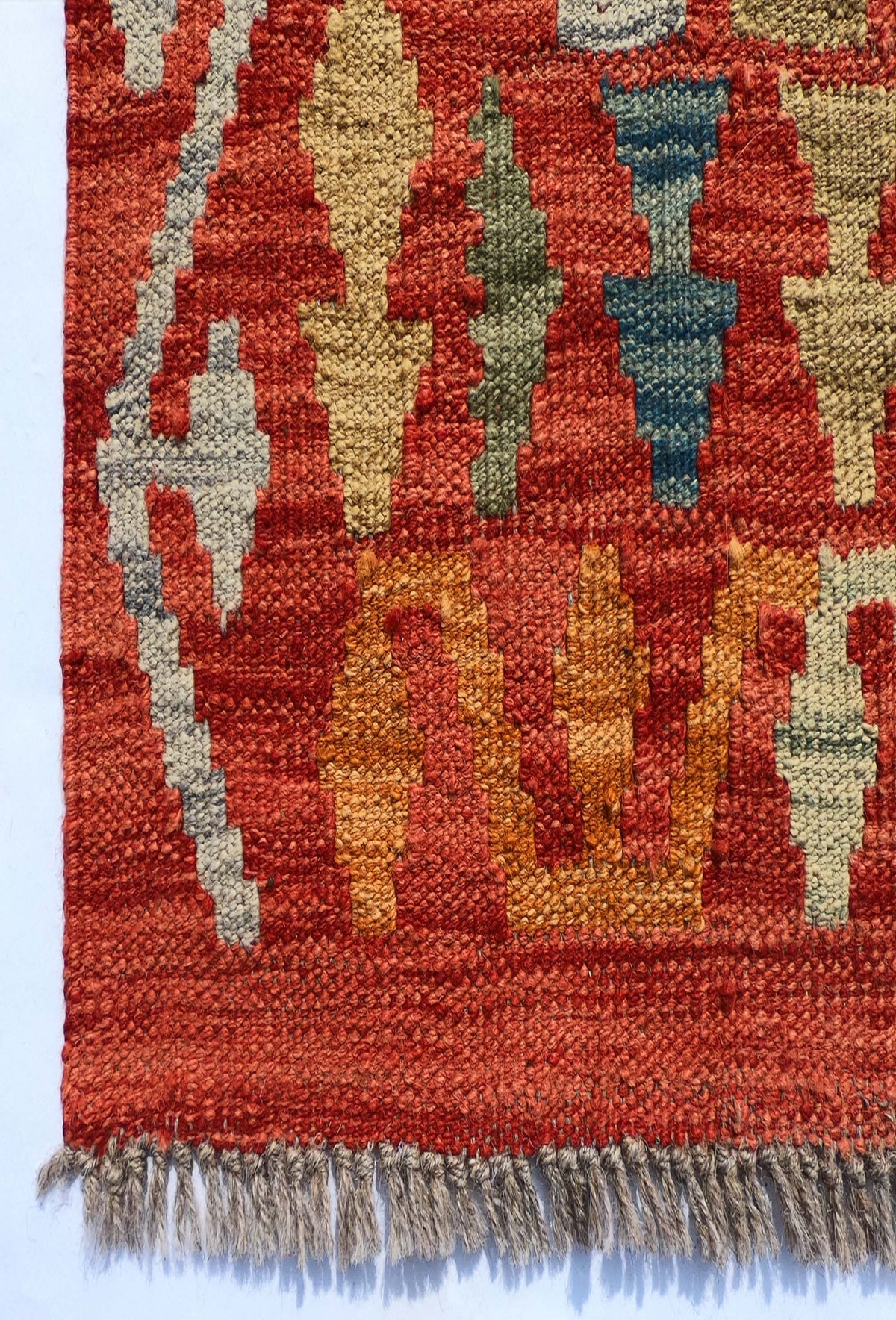 Textura natural de la lana en alfombra hecha a mano estilo kelim