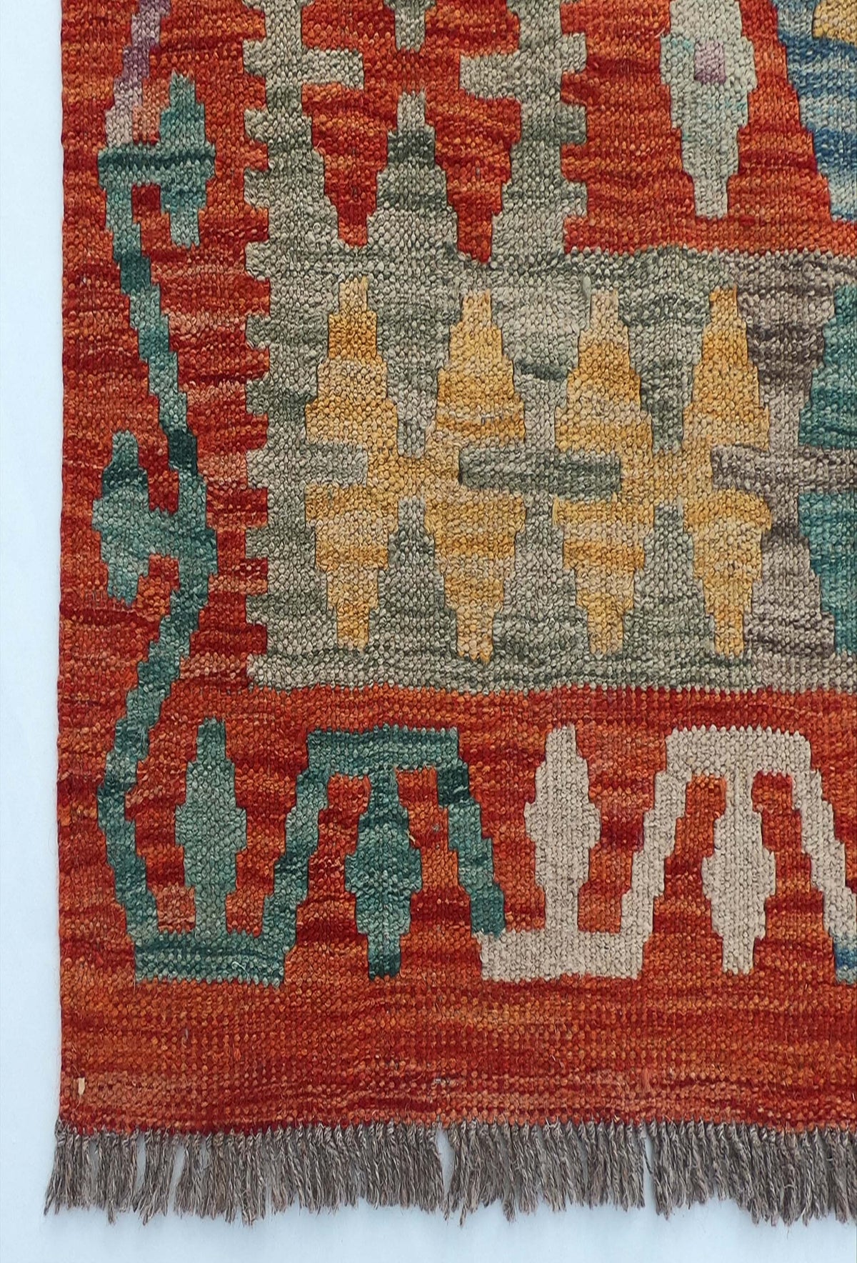 Textura de lana natural en alfombra Kelim hecha a mano con tintes orgánicos