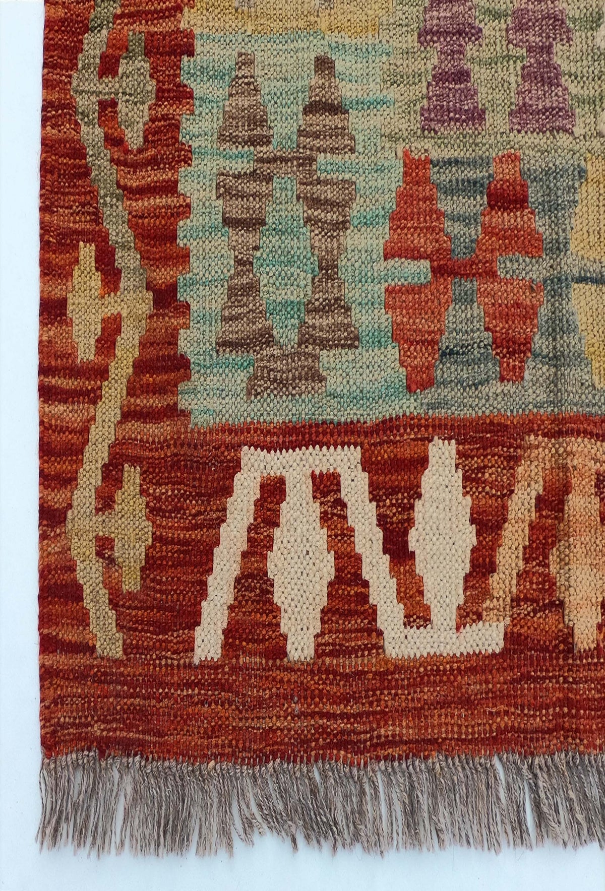 Textura natural de lana en alfombra Kelim importada, teñida con tintes naturales