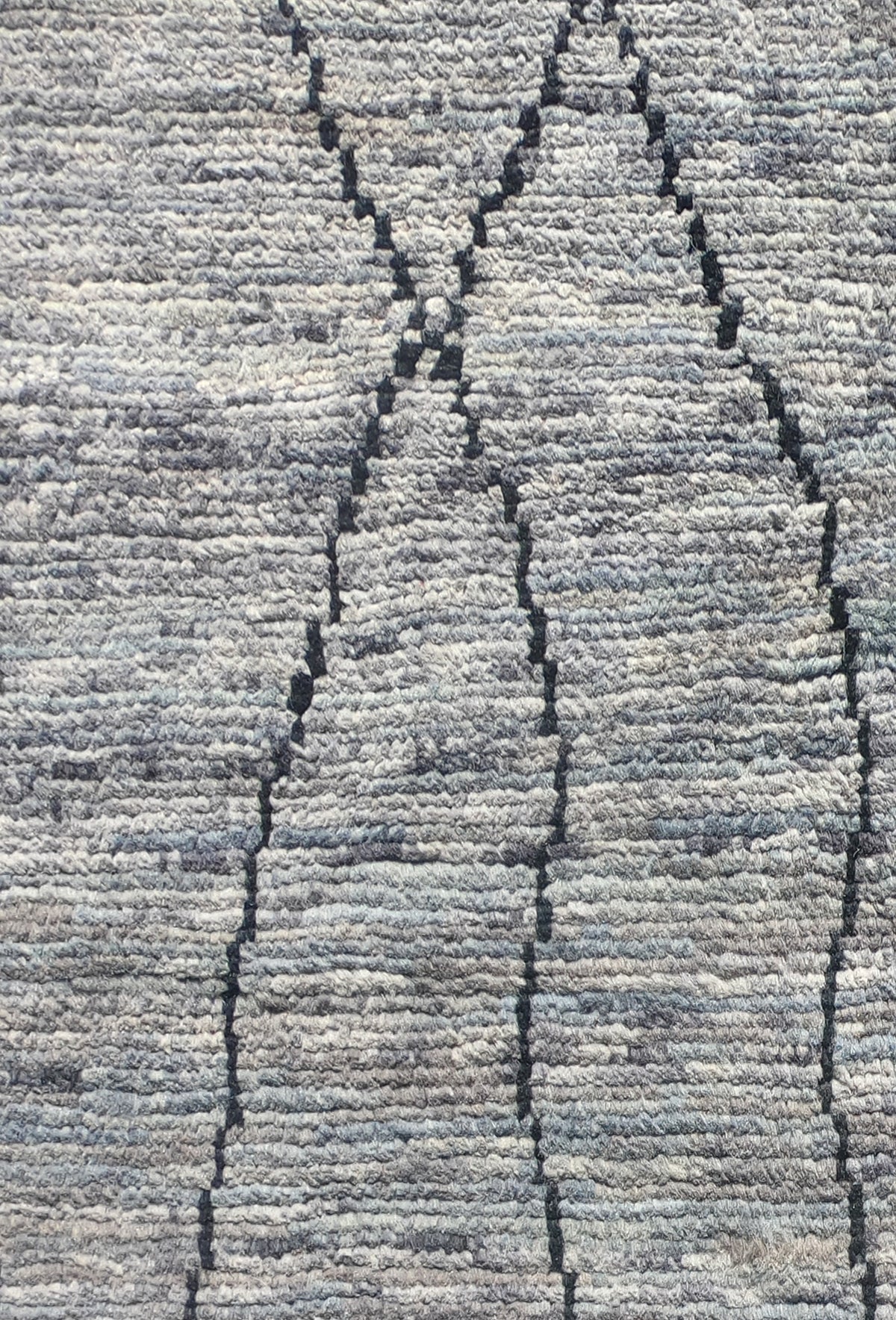 Detalle de patrón geométrico en alfombra persa vintage de lana