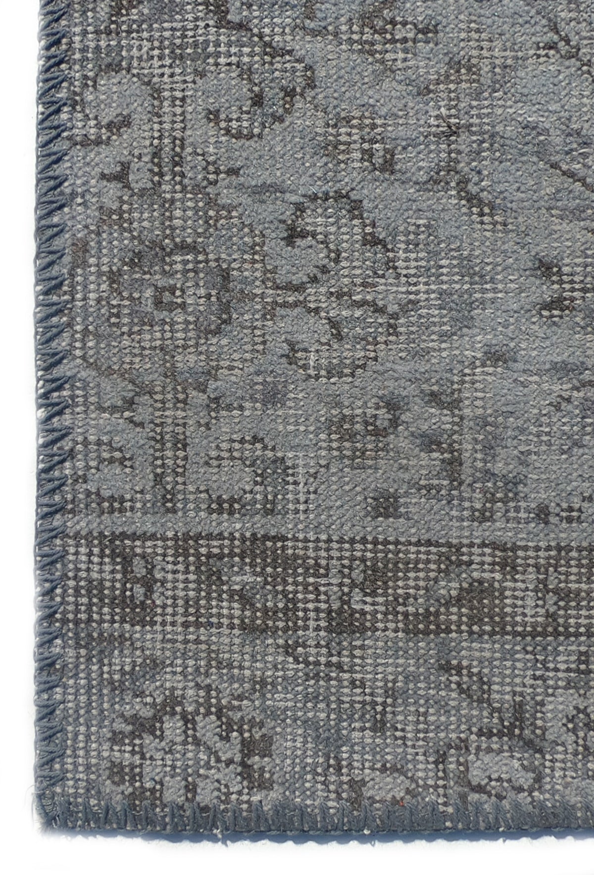 Textura artesanal de lana en alfombra persa vintage importada