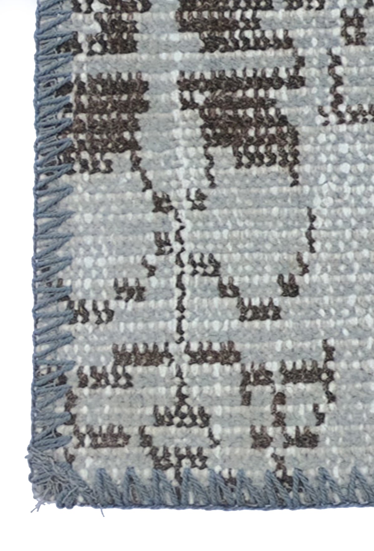 Textura detallada de lana natural en alfombra patchwork turca