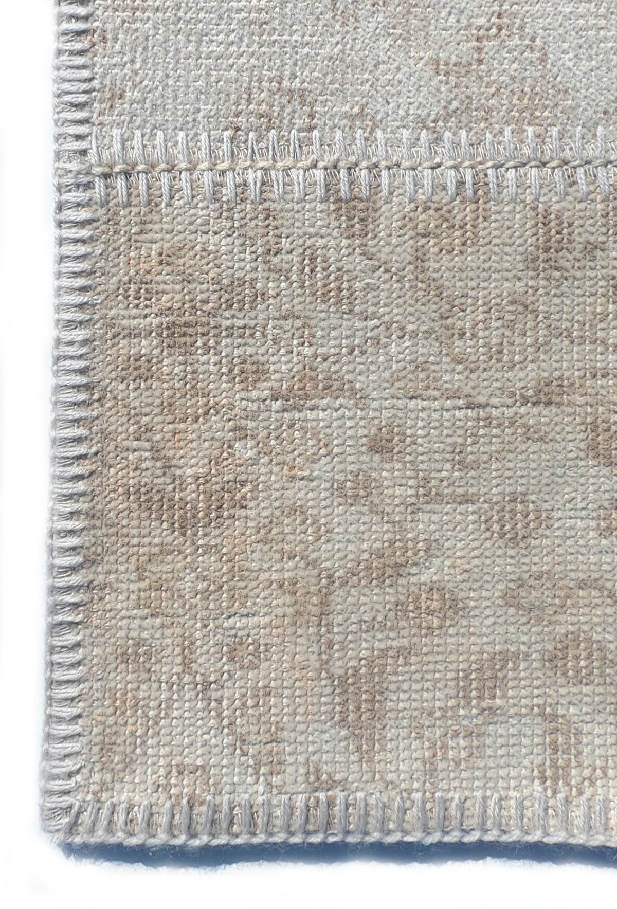 Textura de lana natural en alfombra decorativa hecha a mano