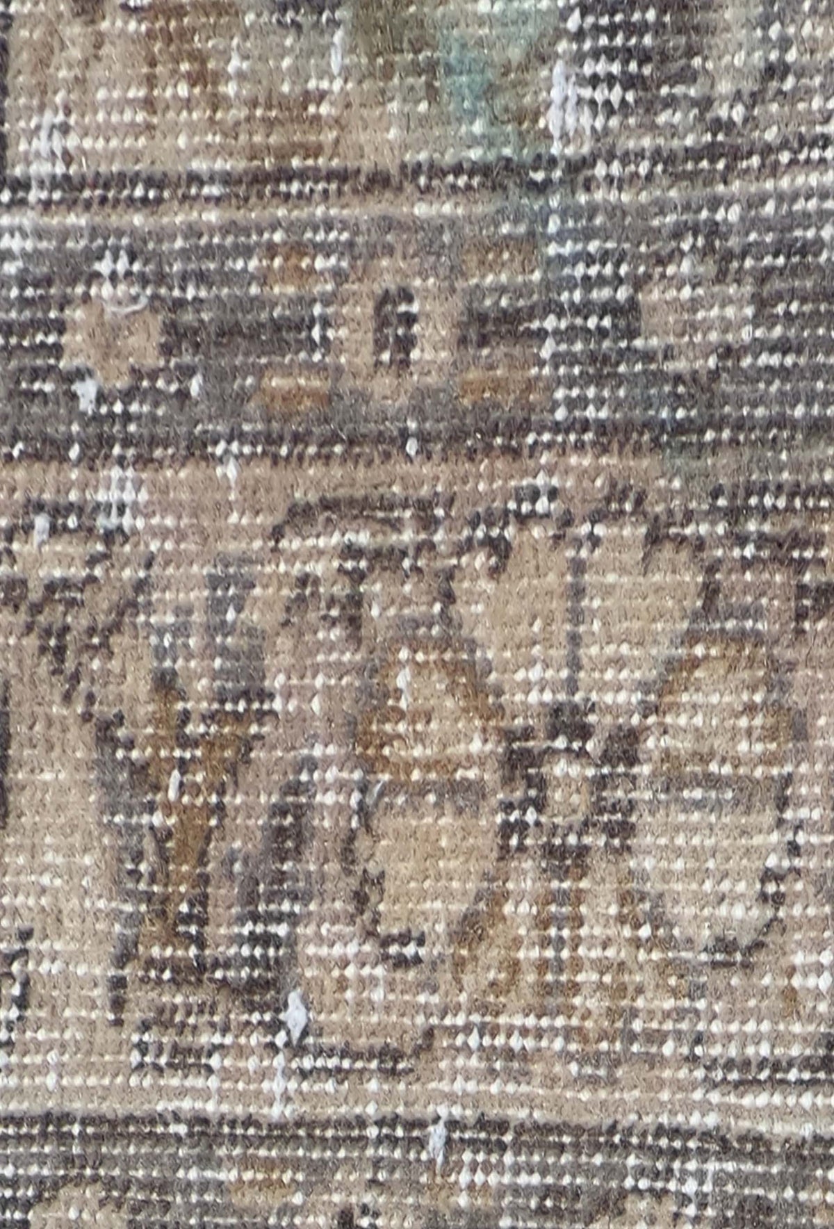 Detalle de diseño patchwork en alfombra turca vintage, aspecto envejecido