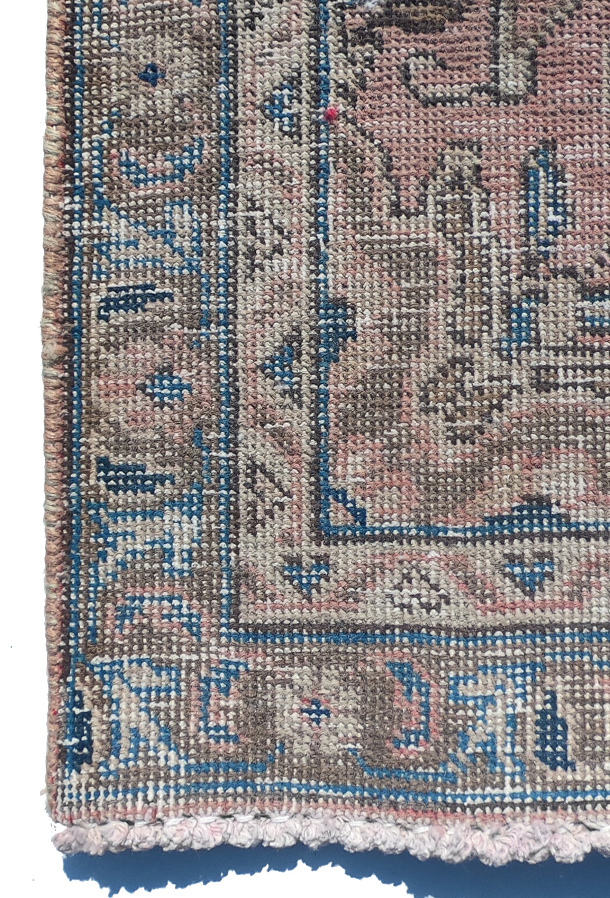 Textura de lana natural en alfombra persa vintage decolorada