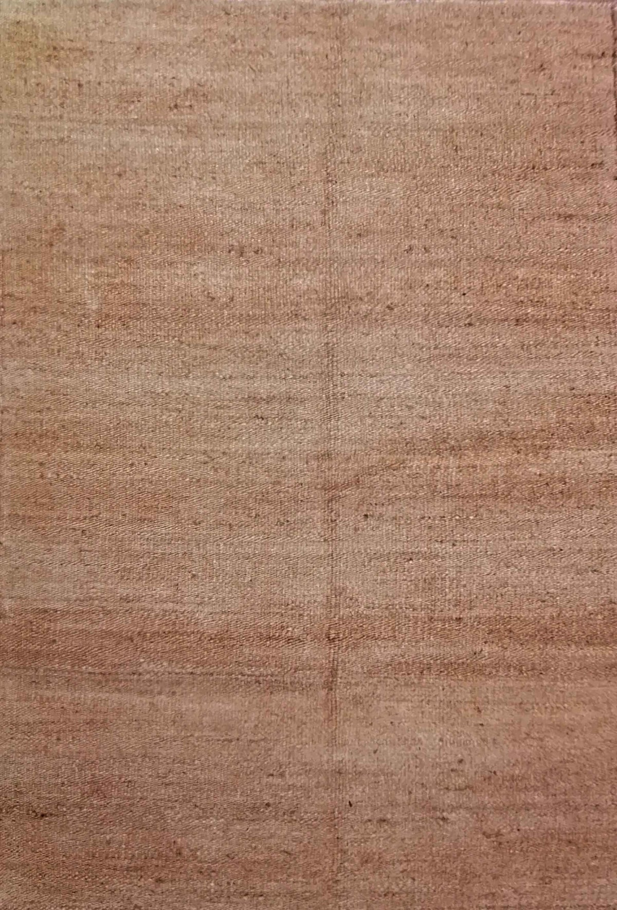 Detalle del tejido artesanal de fibra vegetal en alfombra sisal